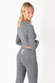 1Enemy's long sleeve ribbed crop top is perfect for training during the colder months. The seamless ribbed texture adds comfort and flexibility for the best fit.   #color_grey