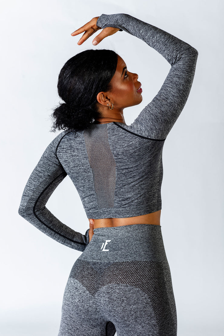 This long sleeve seamless crop top is made of soft and comfortable fabric with mesh details to enhance breathability for your workout.   