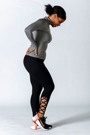 1Enemy's black gym leggings have a cute strappy ankle design and are made of a squat proof material to enhance breathability and support.   #color_black