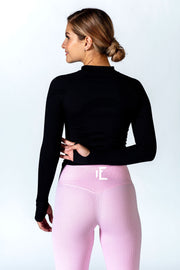 This black workout jacket is built for comfort and style. It has thumbholes to help sleeves from riding up and a zipper that zips all the way up to keep your neck warm.#color_black