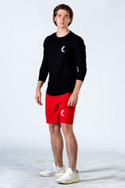 1Enemy's red workout shorts for men are built for performance and function. With two zippered pockets to carry essentials, you will be ready for anything.  #color_red