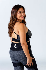 Black and grey seamless sports bra from 1Enemy is the perfect addition to your fitness wardrobe. #color_black-grey-wave