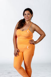 1Enemy's orange workout sports bra has a scrunch feature in the front to enhance comfort and shape.   #color_orange