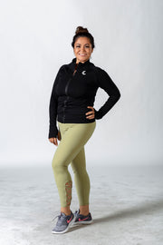 1Enemy's green seamless gym leggings are made of a squat proof material and have a cute strappy ankle design that creates a flattering look for any workout.   #color_green-matcha-latte