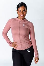 1Enemy's pink workout jacket is built for comfort and style. With thumbholes, you don't have to worry about your sleeves sliding up. #color_dusty-pink