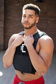 Our weighted vest in black is perfect for leveling up  your strength training and workouts!  #color_black
