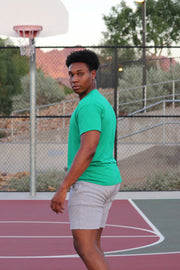 Our men's t-shirt collection is designed for comfort and to endure those tough training days. This black and green t-shirt will be your new favorite workout tee.  #color_green