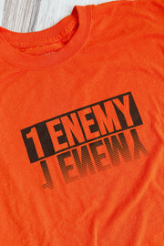 Get your head in the game with this new 1Enemy workout tee in orange and black. A bold new font reflection design to remind us to face the enemy inside.  #color_orange
